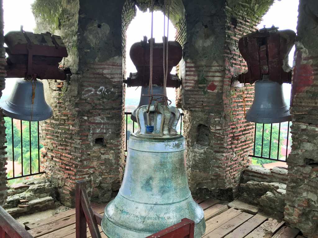 Huge bell with smaller bells at the corners Huge bell with smaller bells at the corners